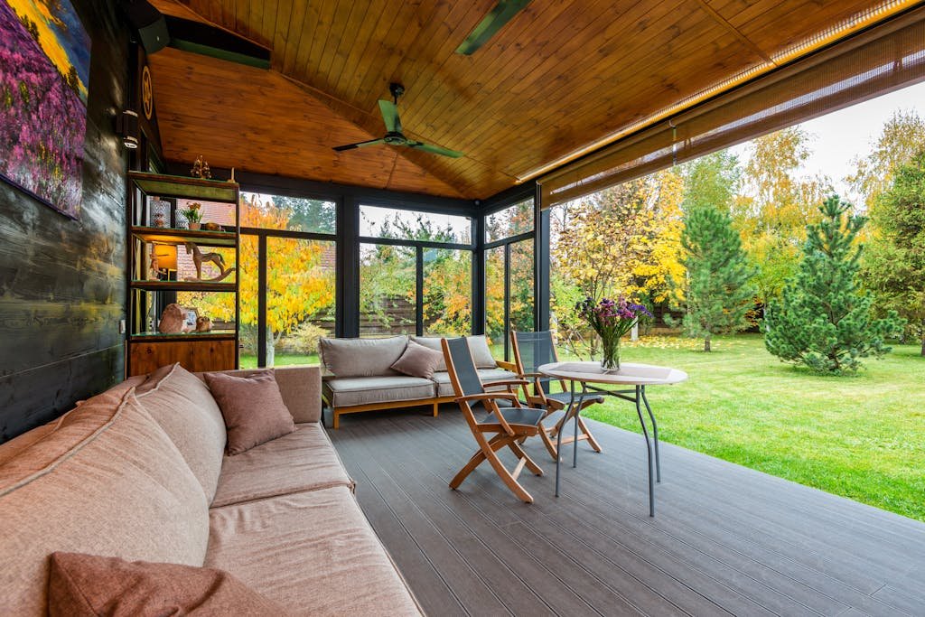 Terrace with comfortable couches and armchairs around table